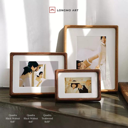Three wooden picture frames on a surface with 'LONGMO ART' branding.